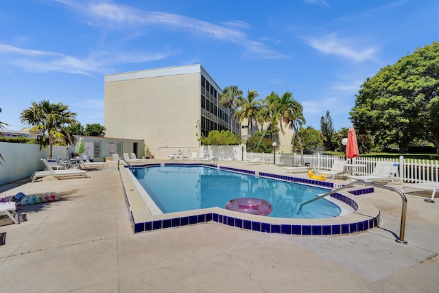 view of swimming pool with a patio