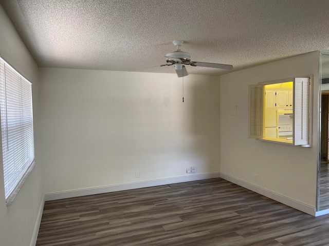 spare room featuring ceiling fan, dark hardwood / wood-style flooring, and a textured ceiling