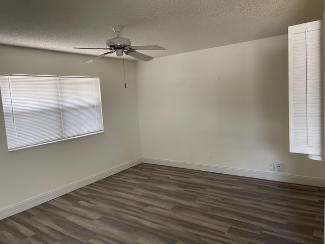 34 Brittany Unit A, Delray Beach, FL 33446 - unfurnished room with baseboards, ceiling fan, dark wood finished floors, and a textured ceiling