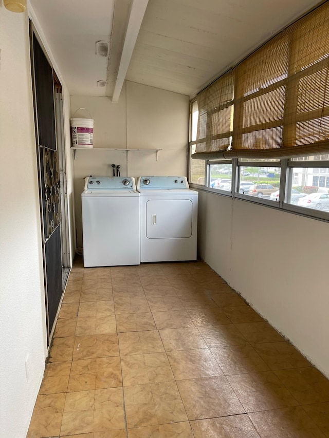 clothes washing area with washer and dryer