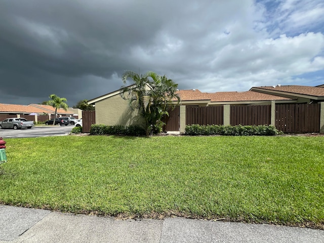 view of property exterior with a yard