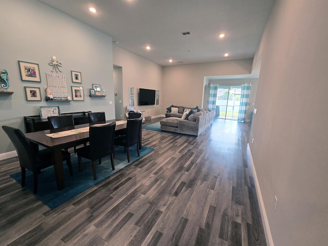 dining room with dark hardwood / wood-style flooring