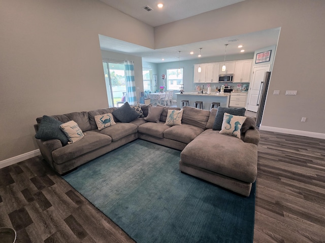 1892 SW Altman Ave, Port Saint Lucie, FL 34953 - living room with dark wood-style flooring, visible vents, and recessed lighting