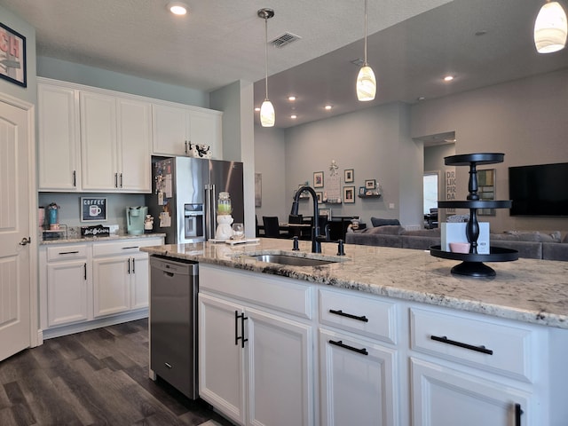 1892 SW Altman Ave, Port Saint Lucie, FL 34953 - kitchen featuring high end fridge, open floor plan, a sink, and dishwasher