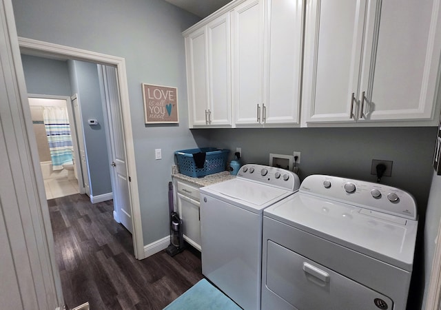 1892 SW Altman Ave, Port Saint Lucie, FL 34953 - clothes washing area featuring cabinet space, baseboards, washing machine and dryer, and dark wood-type flooring