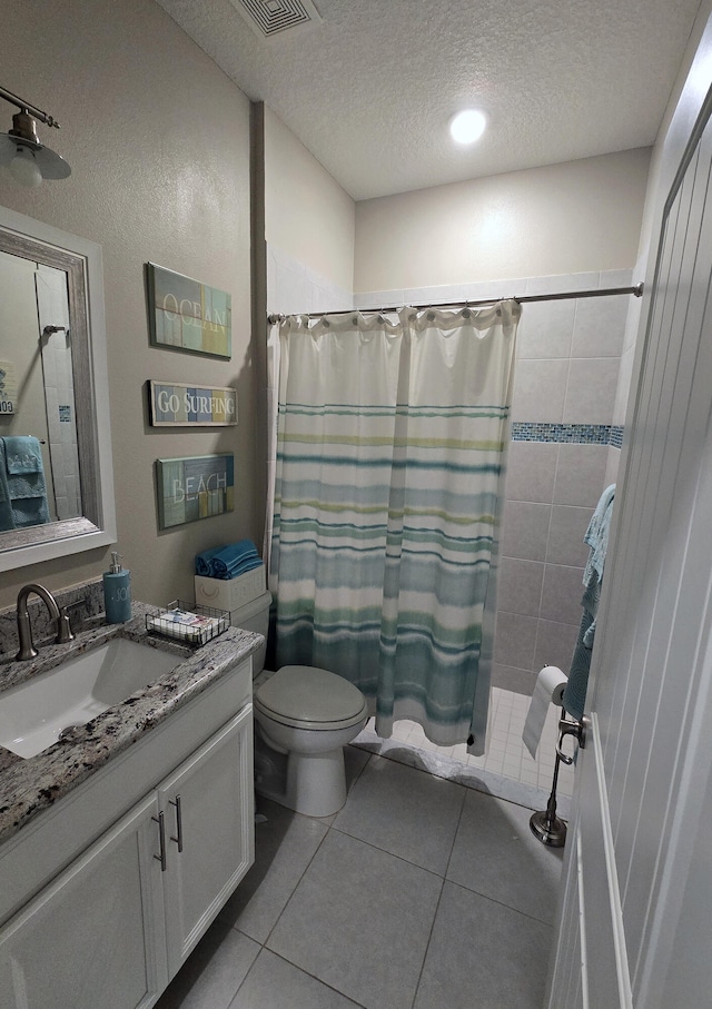 1892 SW Altman Ave, Port Saint Lucie, FL 34953 - bathroom with a textured ceiling, tile patterned flooring, curtained shower, vanity, and toilet