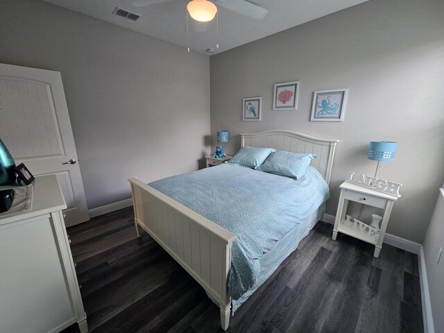 1892 SW Altman Ave, Port Saint Lucie, FL 34953 - bedroom with dark wood-style flooring, baseboards, visible vents, and a ceiling fan