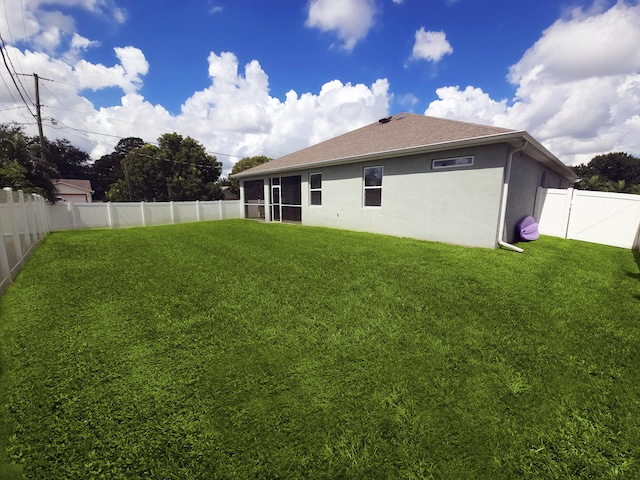 1892 SW Altman Ave, Port Saint Lucie, FL 34953 - view of yard featuring a fenced backyard