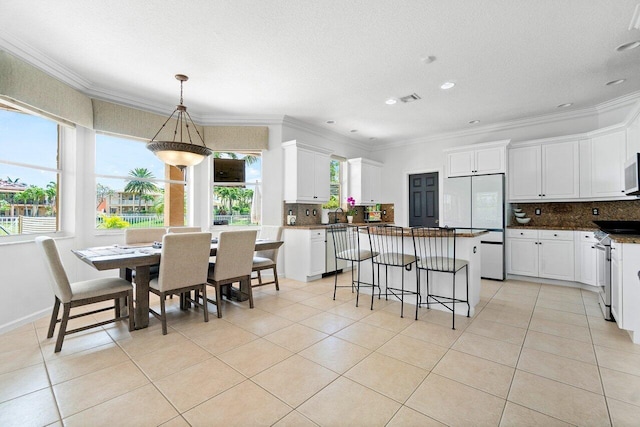 interior space featuring ornamental molding, sink, and a textured ceiling