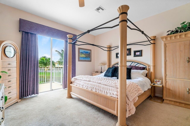 carpeted bedroom featuring access to exterior and ceiling fan