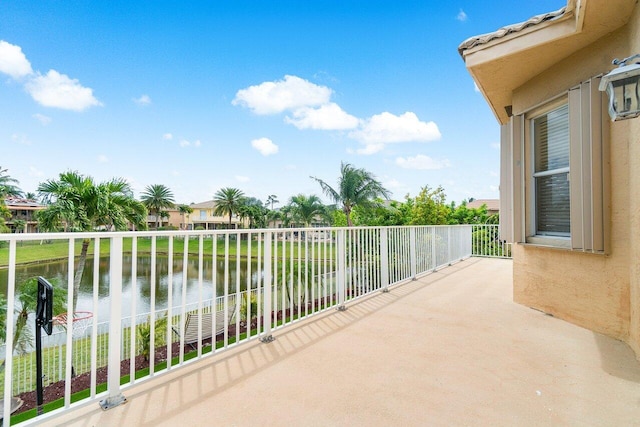 balcony featuring a water view