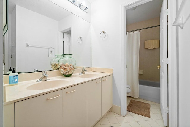 full bathroom with shower / bath combo, tile patterned floors, toilet, and vanity