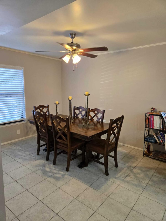 tiled dining area with crown molding and ceiling fan