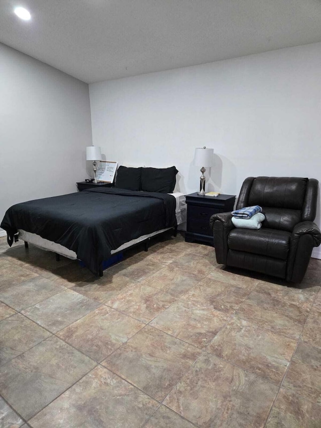 bedroom featuring a textured ceiling