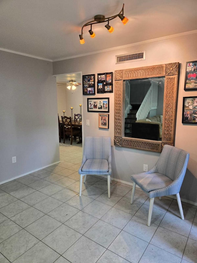 sitting room with crown molding, track lighting, light tile patterned floors, and ceiling fan