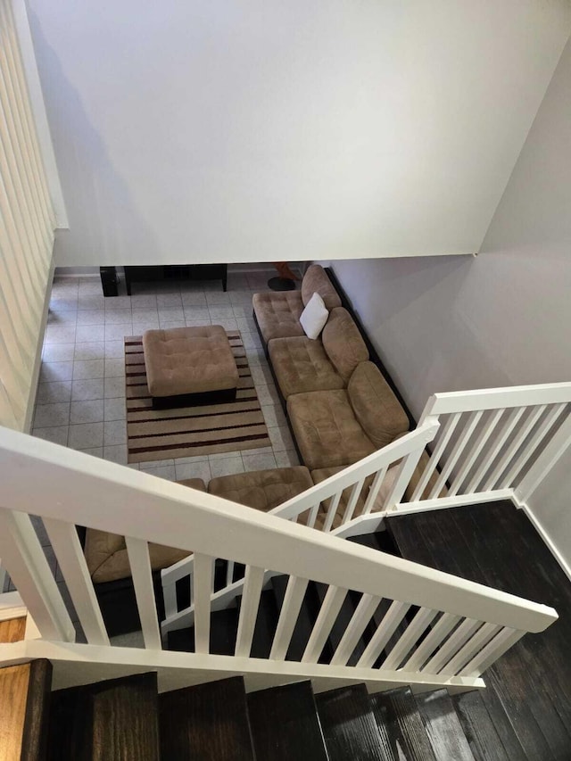 stairs featuring tile patterned flooring