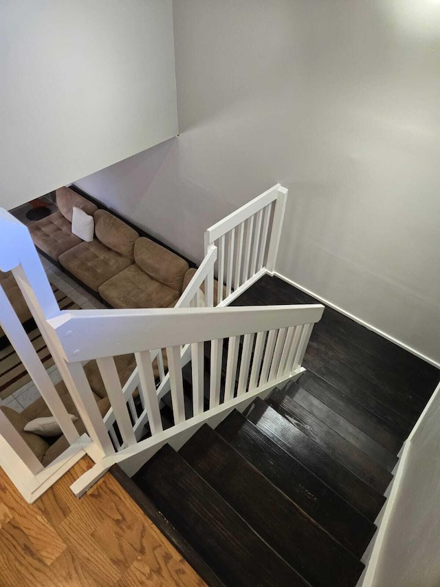 staircase featuring hardwood / wood-style flooring