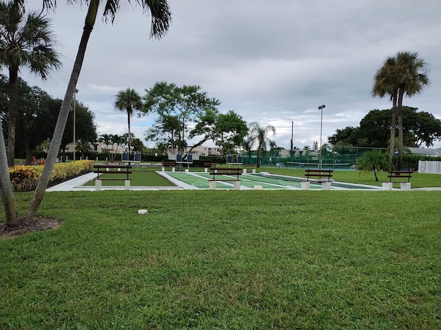 view of home's community with a lawn