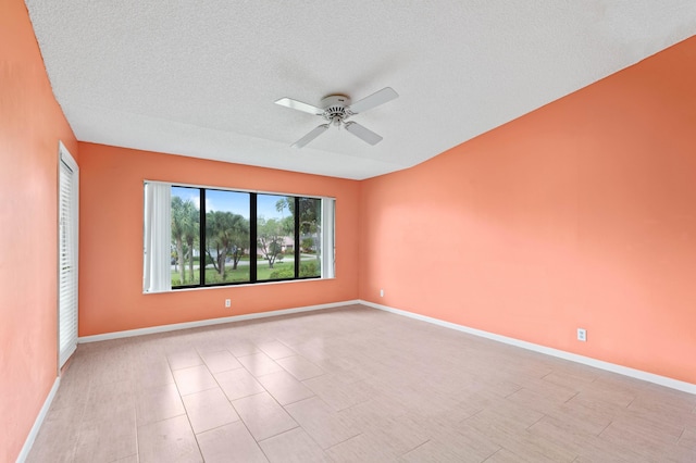 unfurnished room featuring a textured ceiling and ceiling fan