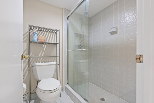 bathroom featuring walk in shower and toilet