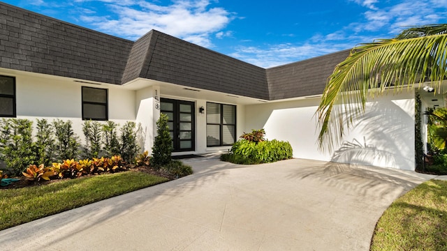 view of exterior entry featuring a garage