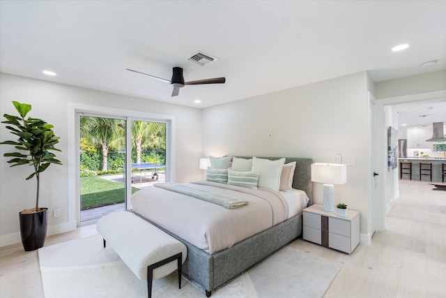 bedroom featuring access to exterior, ceiling fan, and light hardwood / wood-style flooring