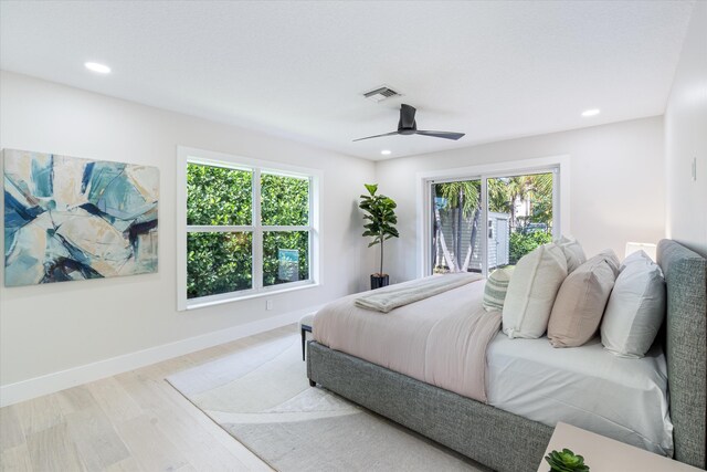 spare room with ceiling fan and light hardwood / wood-style floors