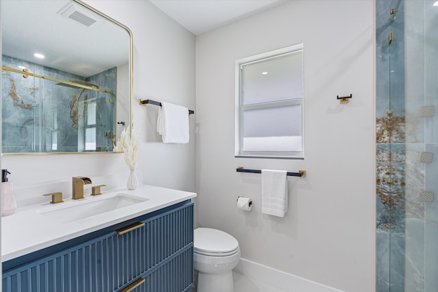 bathroom with vanity, toilet, and walk in shower