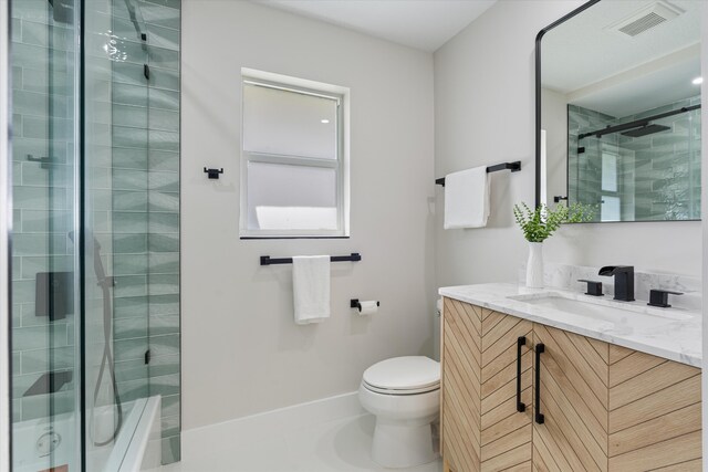 bathroom featuring an enclosed shower