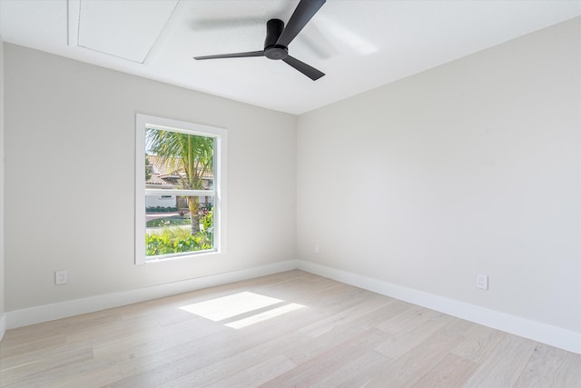 spare room featuring light hardwood / wood-style flooring and ceiling fan