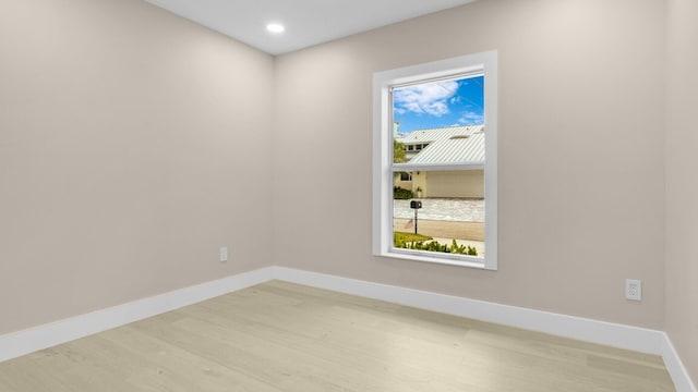 spare room with light hardwood / wood-style flooring