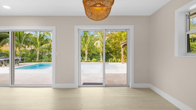 doorway to outside featuring light hardwood / wood-style floors