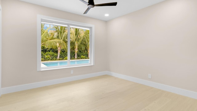 empty room featuring ceiling fan and light wood-type flooring