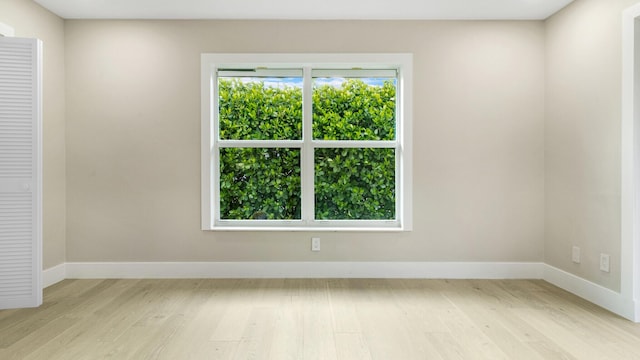 unfurnished room with light wood-type flooring