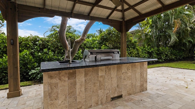 view of patio with a gazebo and exterior kitchen