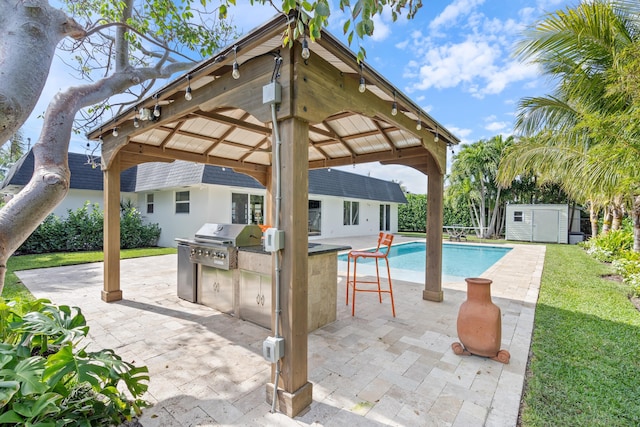 view of swimming pool featuring a gazebo, area for grilling, a patio, and a storage shed