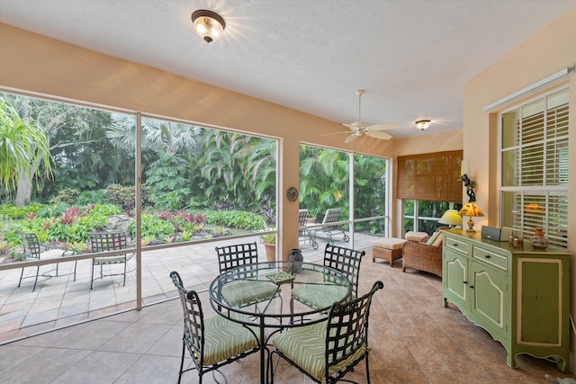 sunroom with ceiling fan and a healthy amount of sunlight