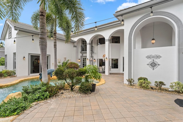 entrance to property featuring a patio area