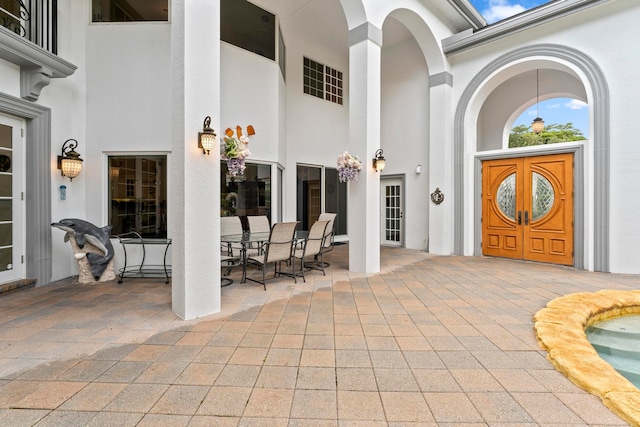 entrance to property with a patio