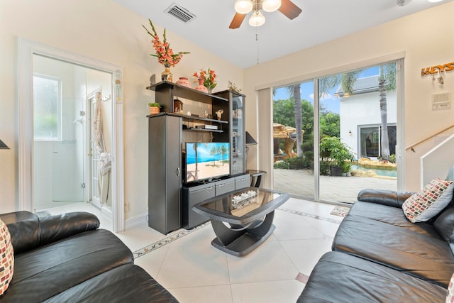 living room with ceiling fan and light tile patterned floors