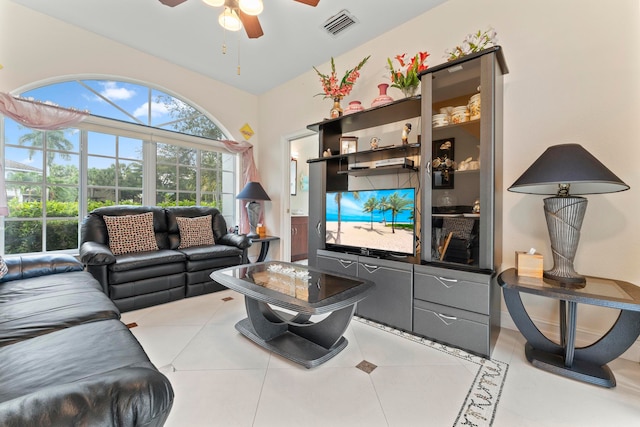 tiled living room featuring ceiling fan