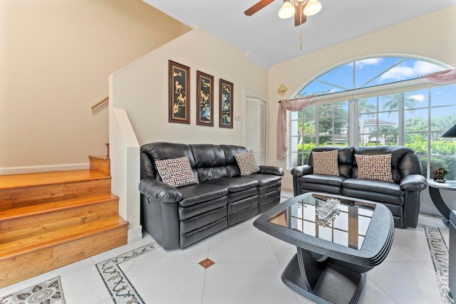 living room featuring ceiling fan and light tile patterned floors