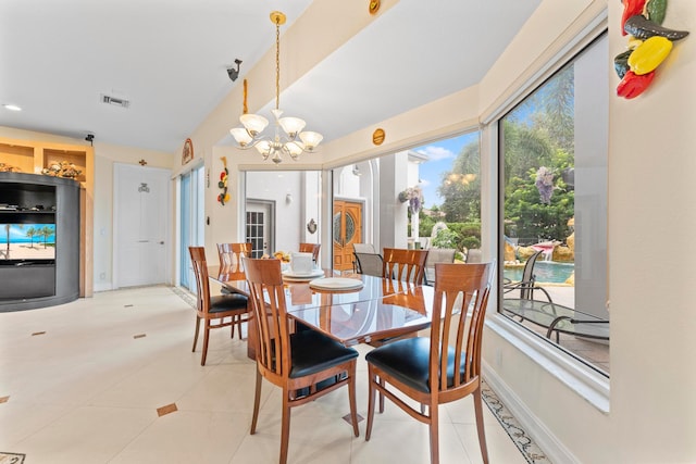 dining area featuring a notable chandelier, plenty of natural light, and light tile patterned floors