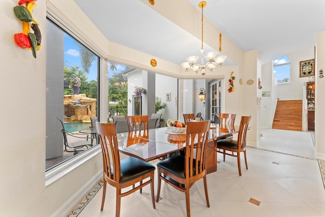 dining room featuring a chandelier and light tile patterned floors