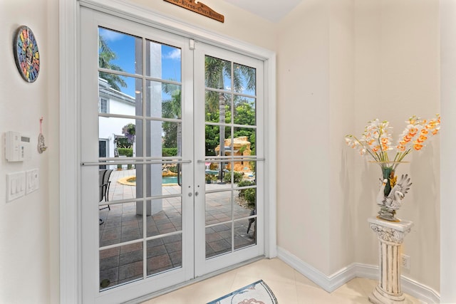 doorway to outside featuring french doors and light tile patterned floors