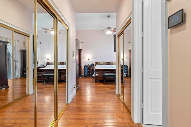 corridor with light hardwood / wood-style flooring