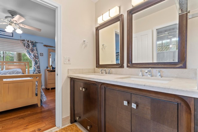 bathroom featuring vanity, wood-type flooring, and ceiling fan