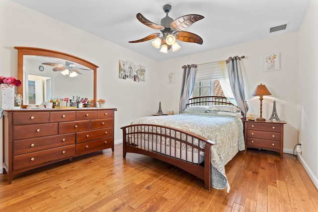 bedroom with light wood-type flooring and ceiling fan