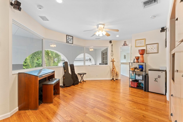 interior space with light hardwood / wood-style floors and ceiling fan