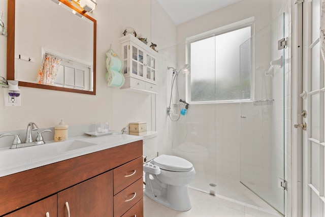 bathroom featuring vanity, toilet, tile patterned floors, and a shower with shower door